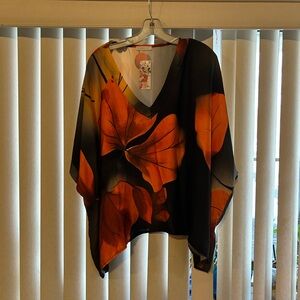 V-Neck Black Tunic with Bold Orange Floral Design